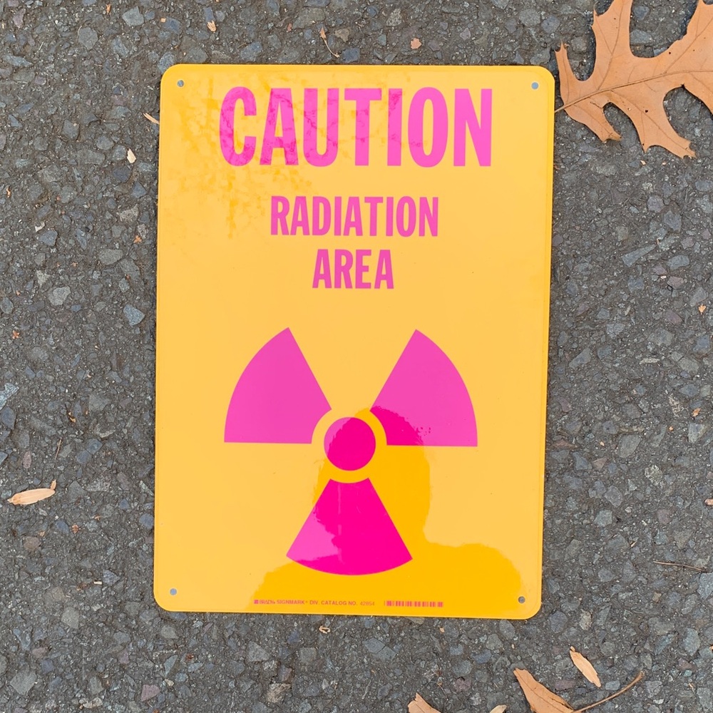 Yellow and Pink metal Caution Radiation Area Sign. New.